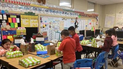 Students Opening Presents Photo